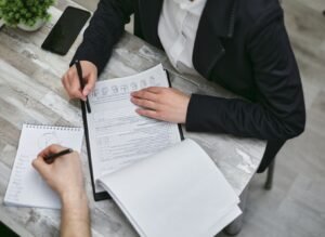 Corporate compliance checklist and company records being reviewed in Pakistan