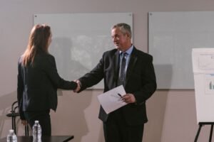 Business colleagues shaking hands, representing corporate agreements and company formation in Pakistan