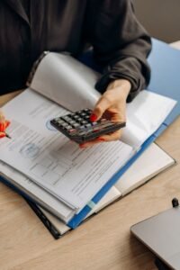Calculator and financial documents representing tax and FBR compliance review in Pakistan