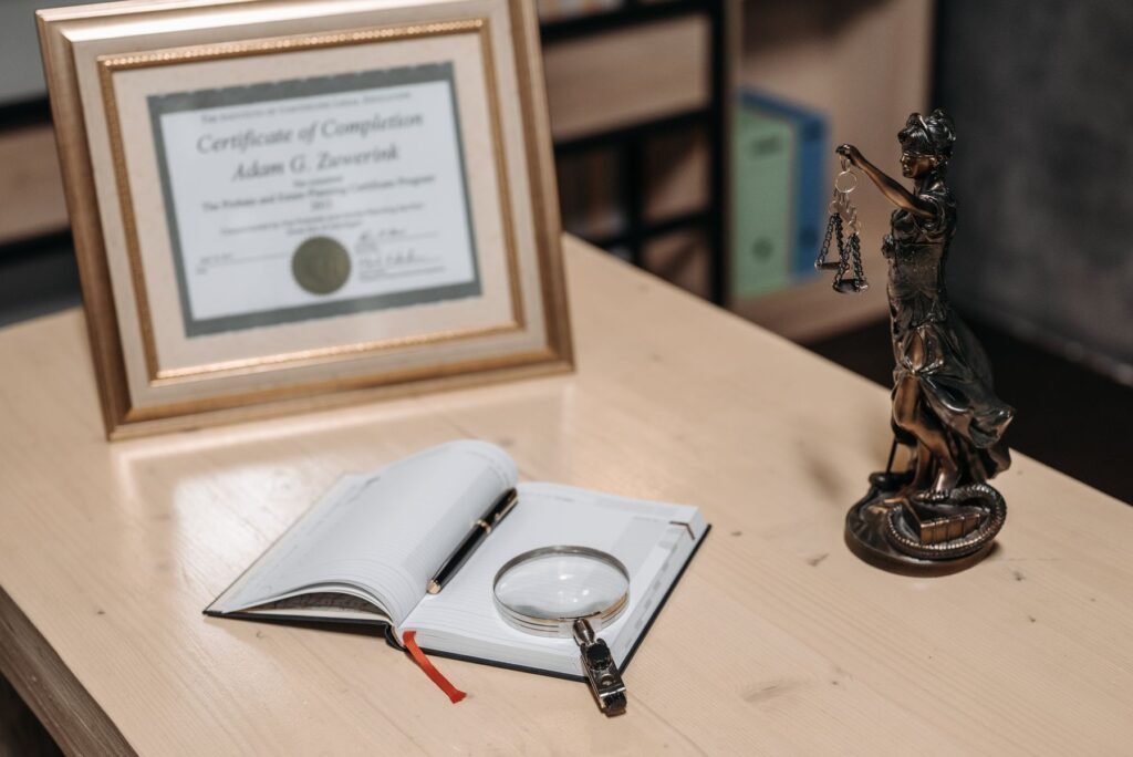 Law book with magnifying glass and scales of justice, representing legal evidence review in Pakistan
