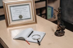 Law book with magnifying glass and scales of justice, representing legal evidence review in Pakistan
