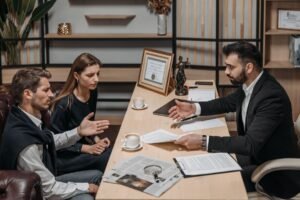 Lawyer consulting with clients about inheritance and succession documents