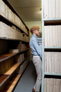 Land records archive shelves, representing property mutation and land record transfer in Pakistan